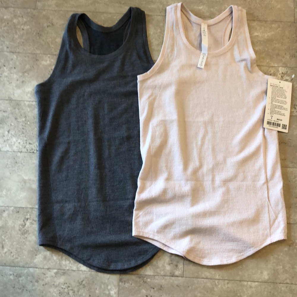 two lululemon aerial silk tanks.